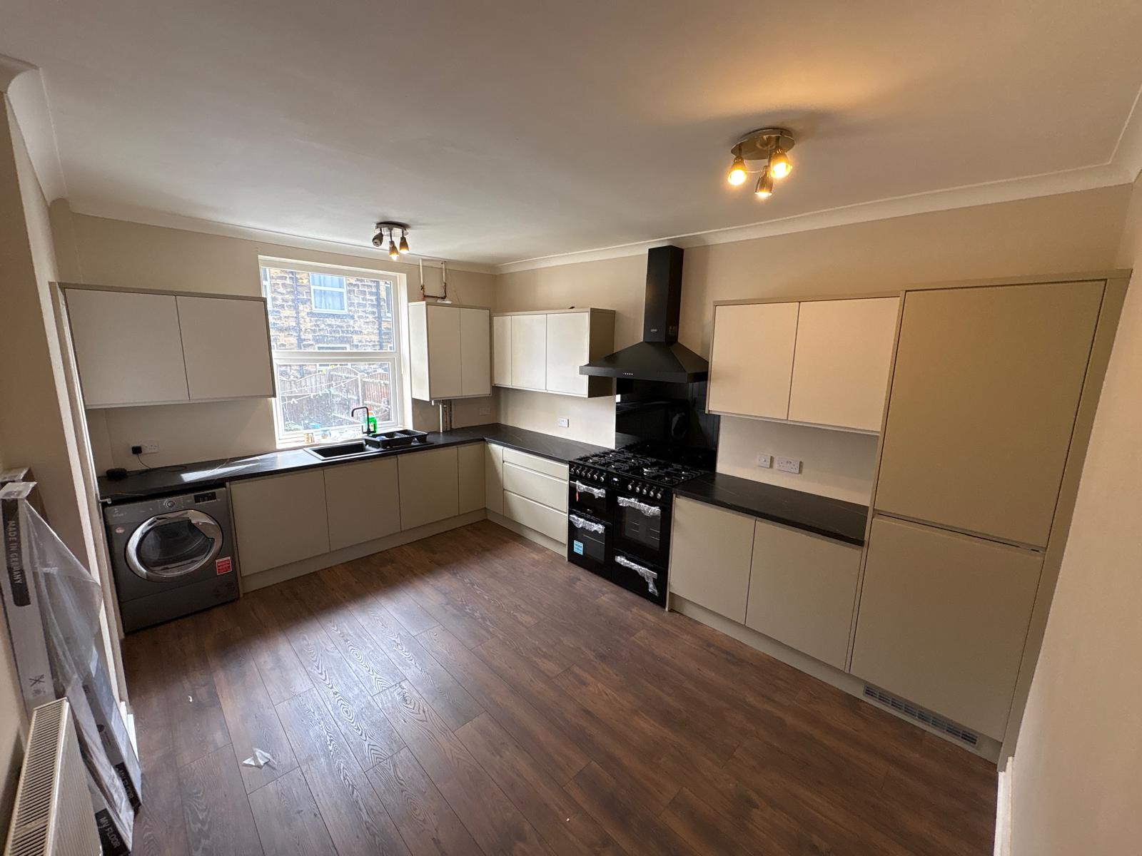 Dated beech kitchen stripped out and replaced with a modern cream handleless kitchen, range cooker, chimney extractor, new flooring and full redecoration throughout.