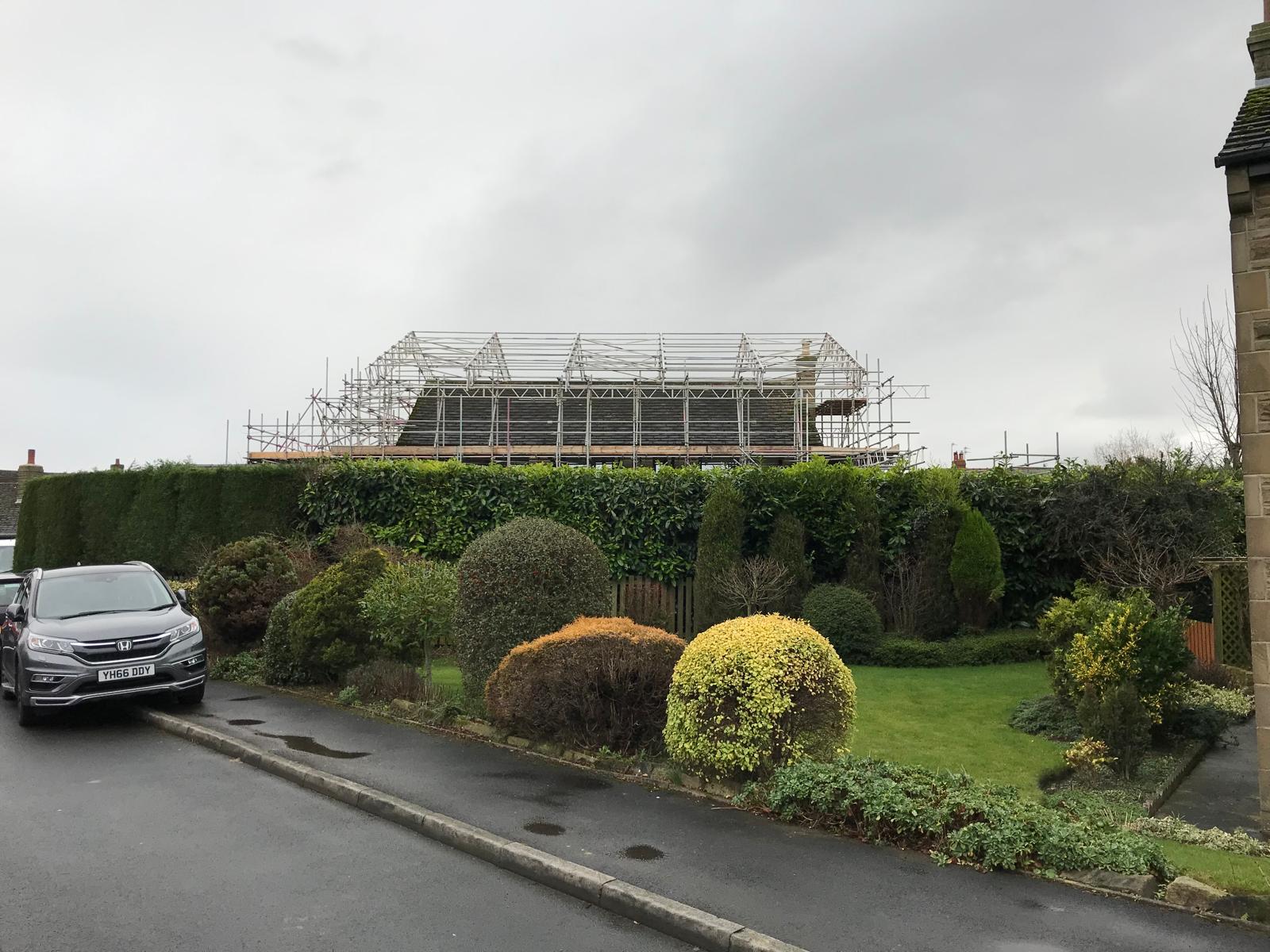 Emergency structural rescue of a failing roof gable — bespoke scaffold designed to hold the wall, full temporary roof erected, trusses removed and replaced. Read the full case study.
