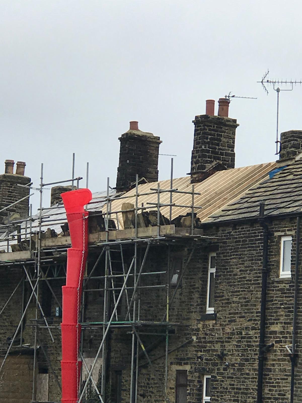 Three adjoining Victorian terraces in Idle gutted by a serious house fire, stripped back to masonry and rebuilt bottom to top — new roofs, chimneys, floors, kitchens and bathrooms across all three properties.
